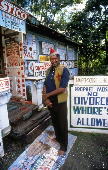 No Divorce Whore’s Allowed, photo of 'Prophet' Royal Robertson and at his house and yard art environment in Baldwin, Louisiana, USA by Royal Robertson (Photo by Michael Edward Smith)