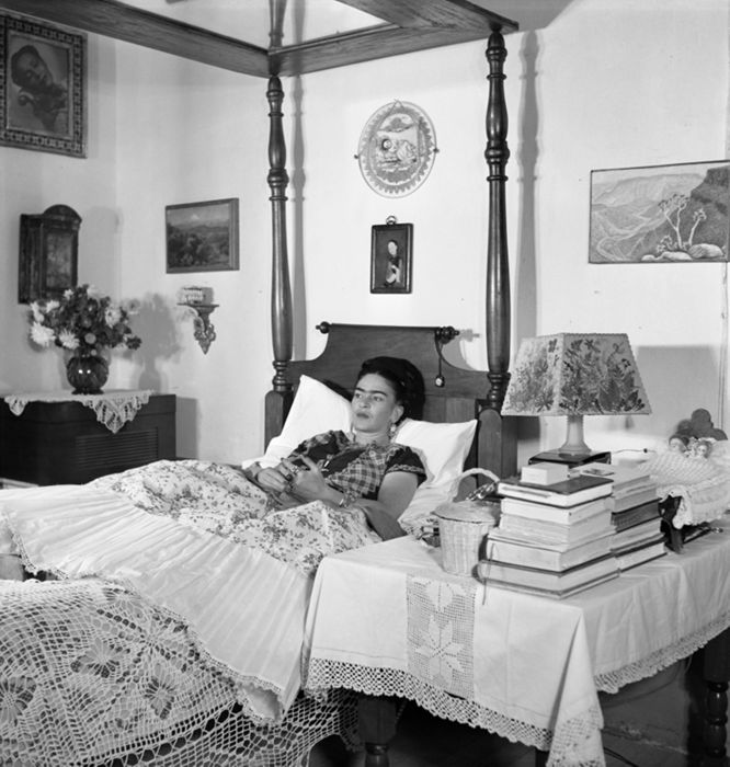 Frida Kahlo, wife of Rivera, a painter herself (Frida Kahlo in her bed) by Gisèle Freund